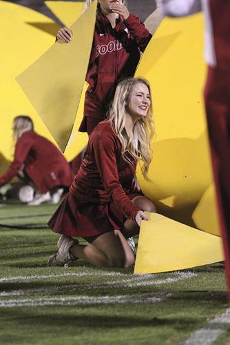 Pom dancer with a sign
