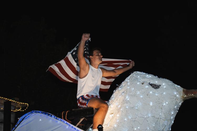 Sooner holding American flag
