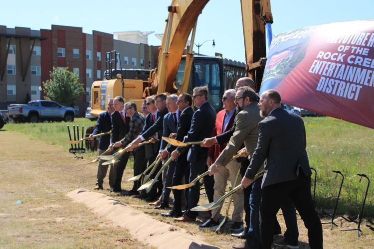 Speakers dig at the Rock Creek Entertainment District groundbreaking.