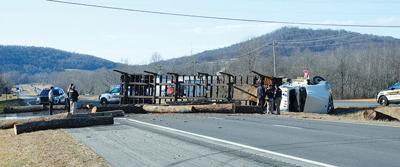 Log truck loses load on Hwy 111