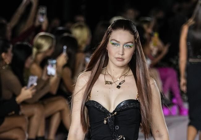 Gigi Hadid Walked the Runway in a See-Through Metallic Fishnet Dress