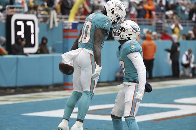 Miami Dolphins wide receiver Tyreek Hill (10) stands on the field during  the first half of an NFL football game against the New York Jets, Sunday,  Jan. 8, 2023, in Miami Gardens