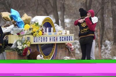 Search on for 2 parents charged in Michigan school shooting
