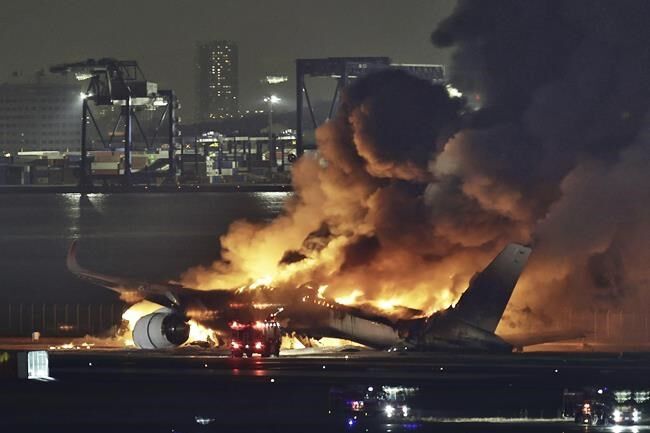 Planes collide and catch fire at Japan's busy Haneda airport, killing 5.  Hundreds evacuated safely | World News | pentictonherald.ca