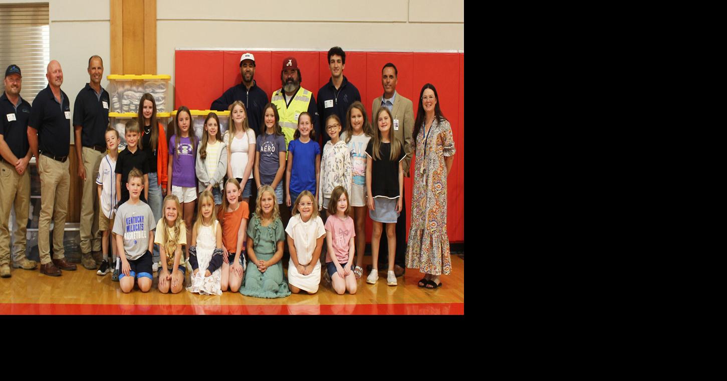 Power plant construction crews donate clothing to schools