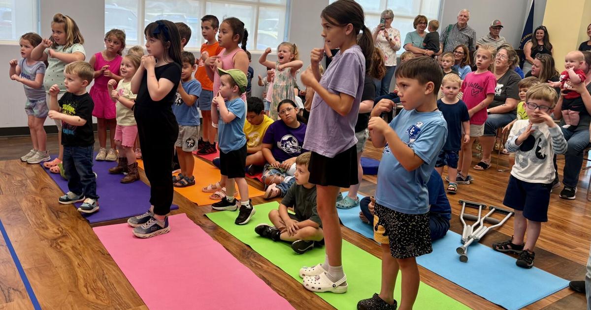 “Unearth a story”: Dinosaurs flock to public library for summer reading bash
