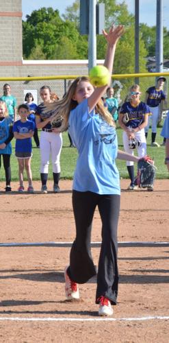 Khloie Finkenstead throws out the first pitch at the Lady Braves softball game May 4
