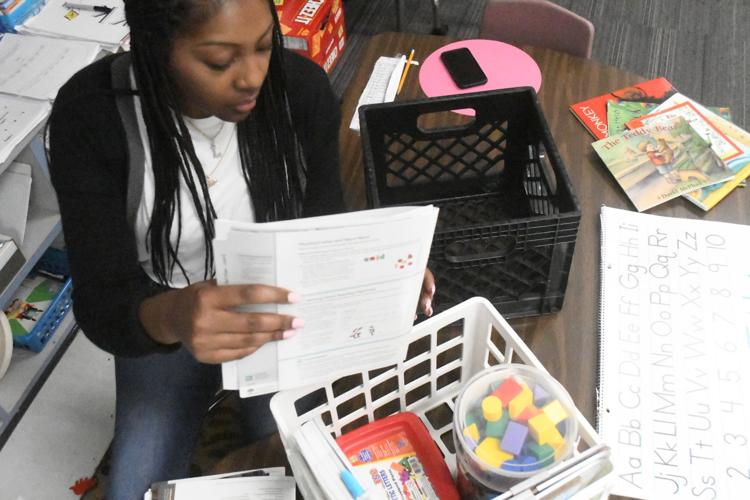 Ms. McGriff packs up to prepare for time away from her classroom