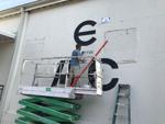 Ethos Athletic Club sign being painted
