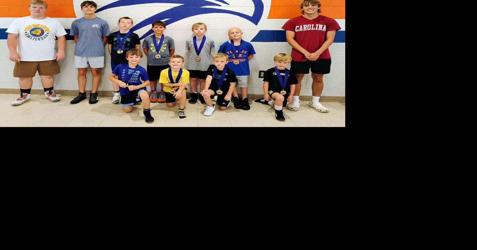 Hawks coaches, grapplers host youth camp