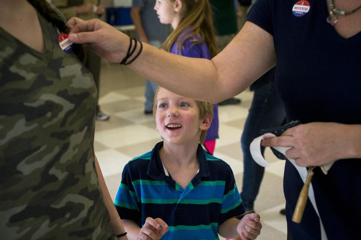 Kid voting PRINT secondary.JPG