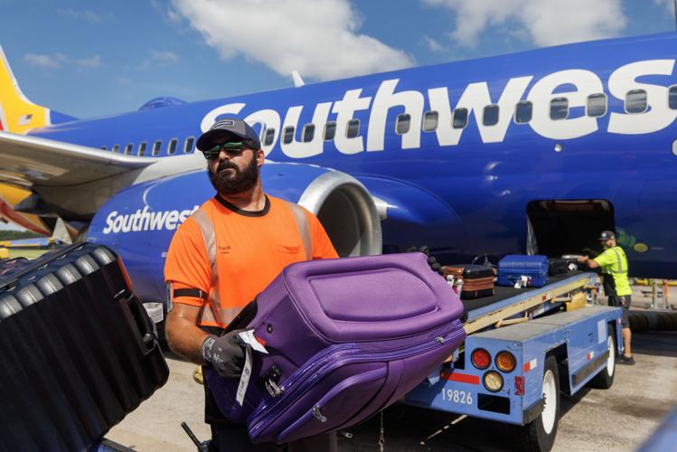 Loading/unloading Sack Charleston airport sets new Summer passenger record