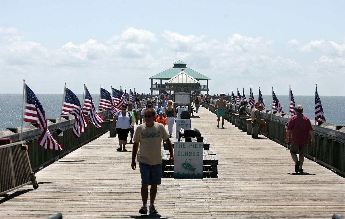 Beachgoers last summer stand