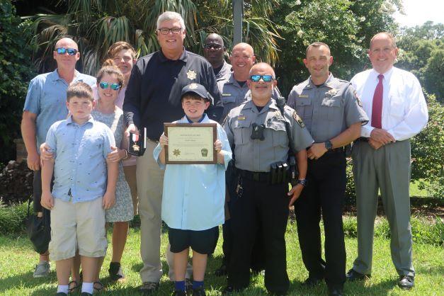 Jack Olsen, 12, was honored July 18 by the Georgetown County Sheriff’s Office July 18 for his quick action in calling 911 in June. 