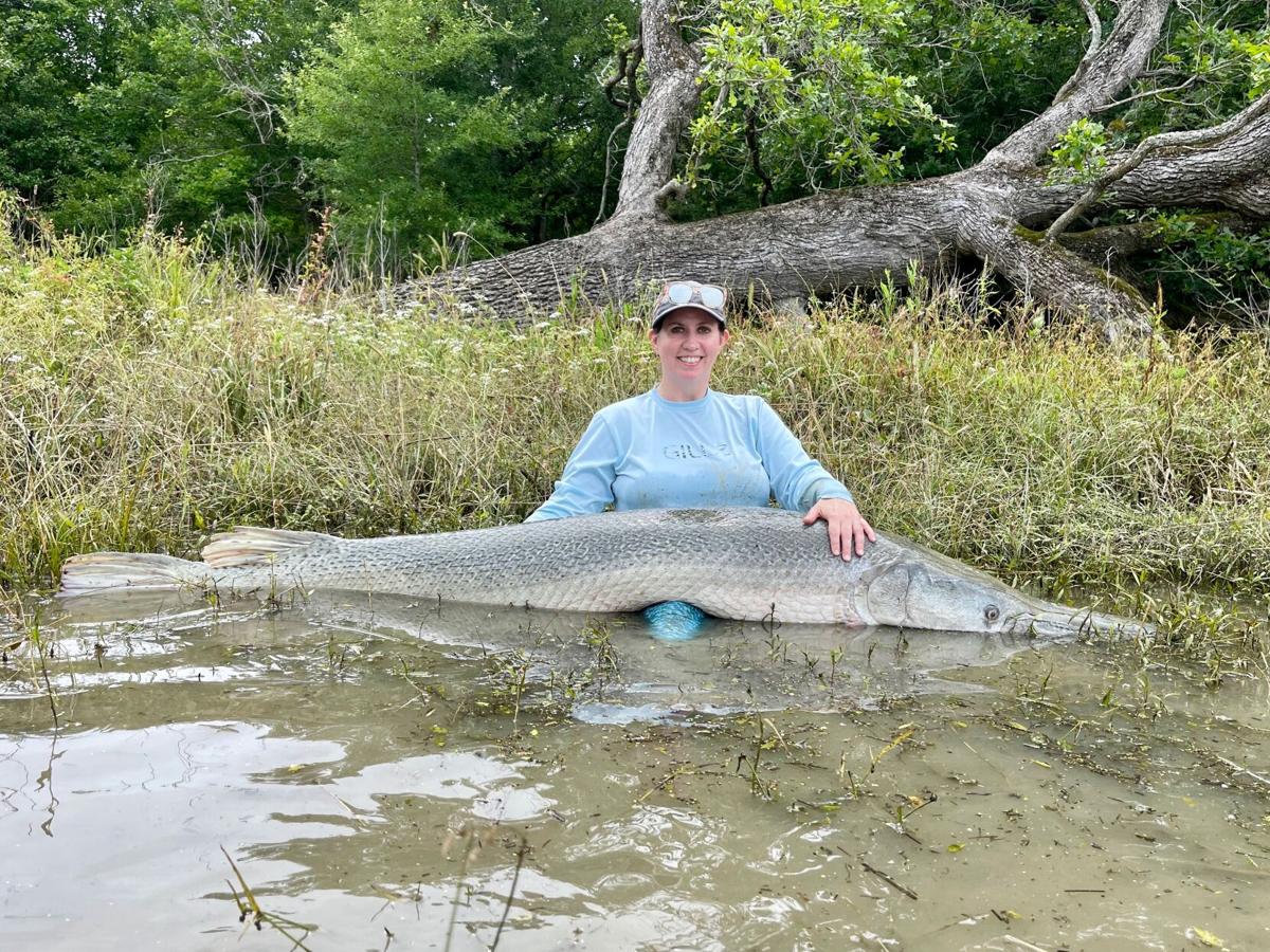 Summerville woman catches giant alligator gar that appears to be world  record