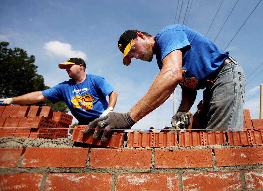 Brick masons do their level best Teams of craftsmen compete for