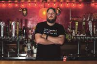 Phill Blair behind bar at The Whig