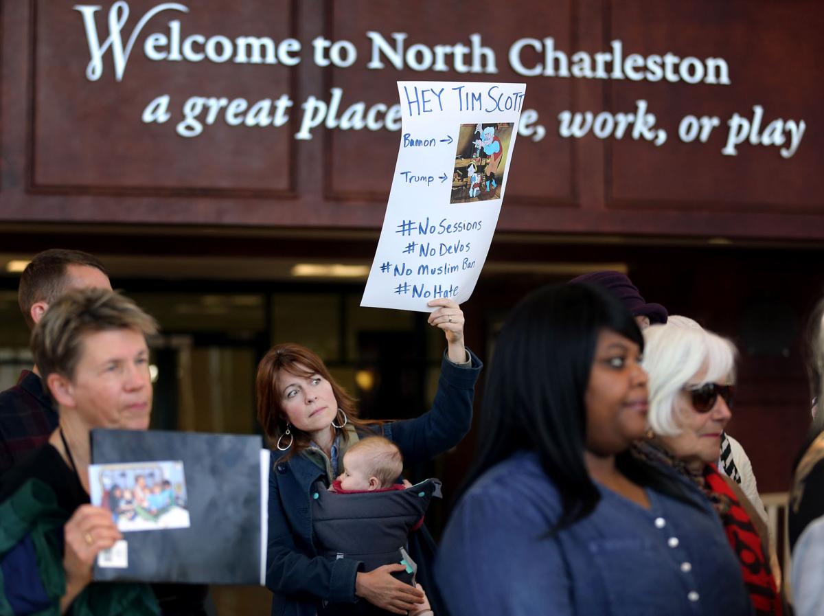 pc-021917-ne-activism mom sign.jpg (copy)