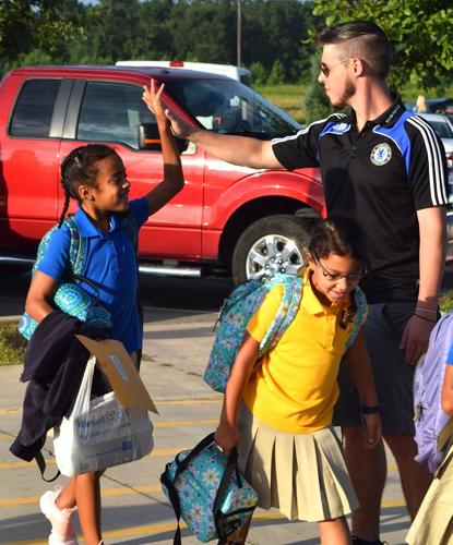 Car line greetings get Horse Creek Academy students in gear for