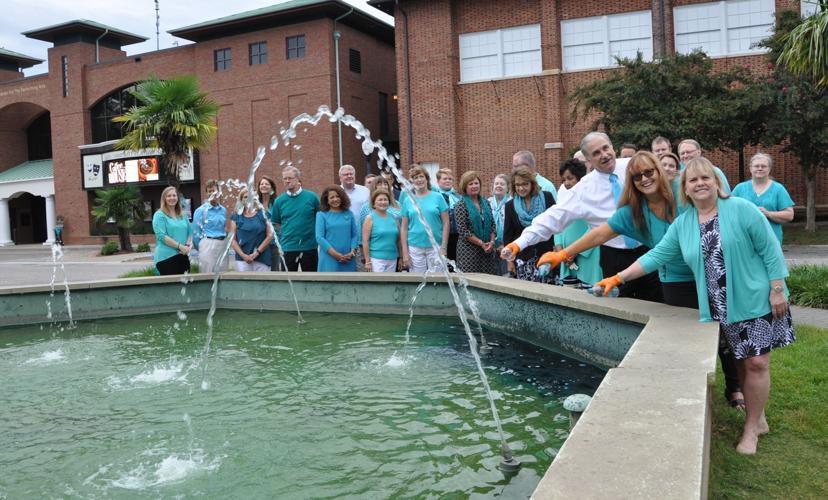 Gail's Anatomy turns the Newberry Street fountain teal for Ovarian Cancer Awareness Month 1