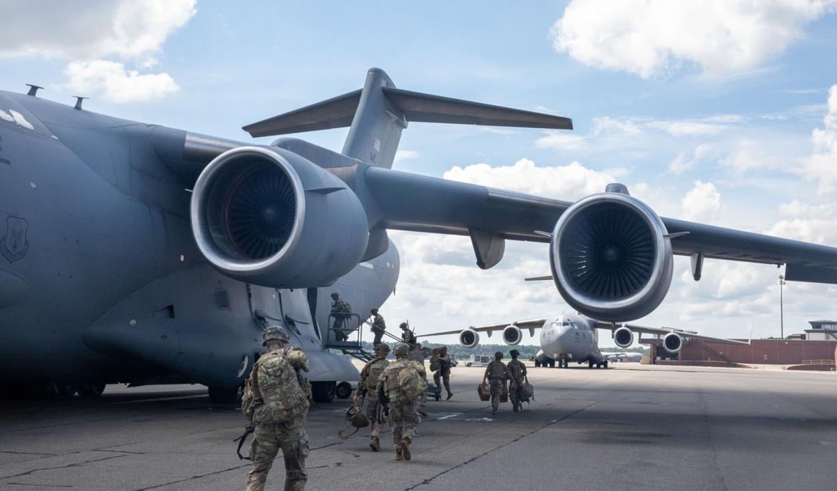 Joint Base Charleston crews load troops, vehicles onto C17s to aid
