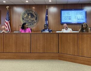 ‘Junked-up looking strip mall’: Florence Council split on ordinance to limit window signs at stores