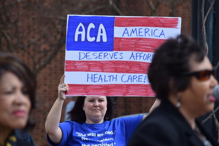 Locals share stories, support at health care rally