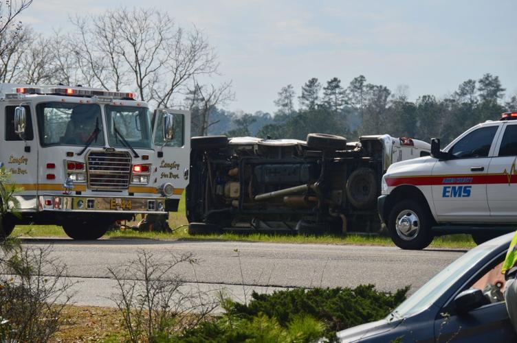 Threecar collision causes van to flip, possible entrapment reported in