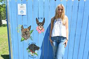 Dog portraits turn Lynches River fence into a growing tribute to beloved pets