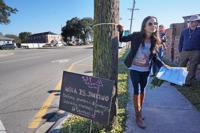 Julia Kumari Drapkin, founder of I See Change, by an area that's sinking in New Orleans