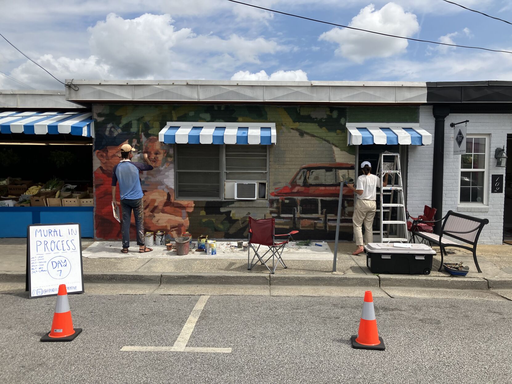 Muralists memorialize Lake City fruit stand owner during