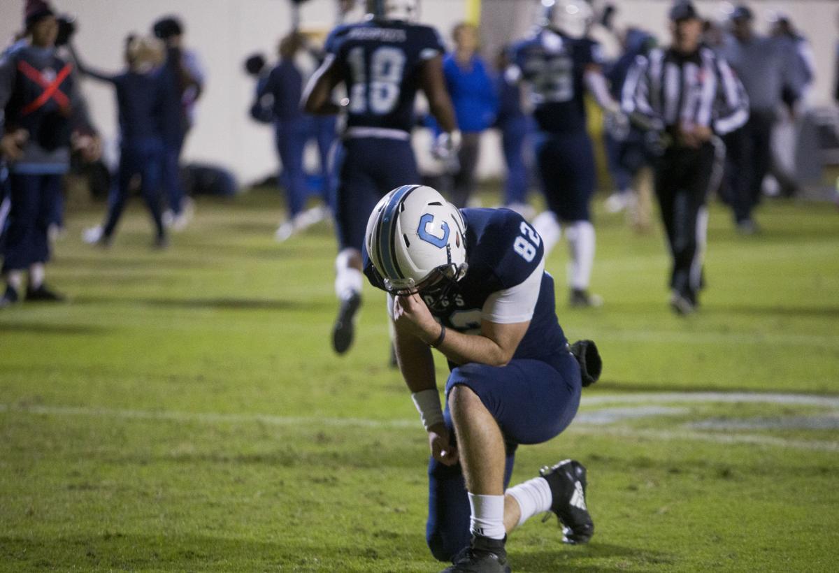 Brandon Rainey prays.JPG