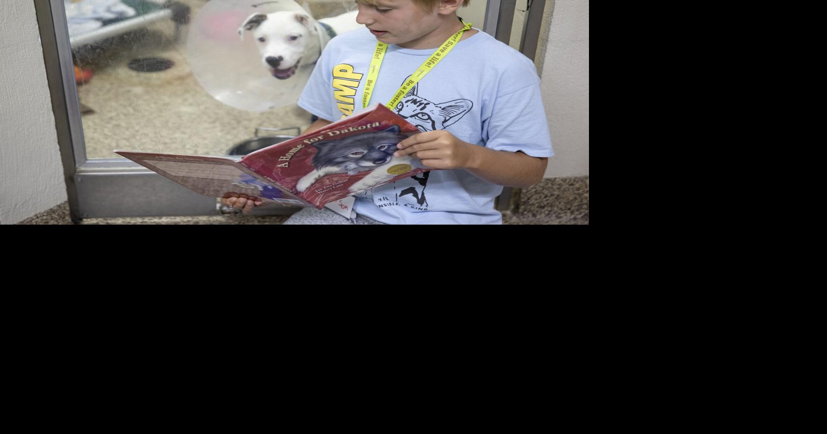 Charleston Animal Society offers summer program where kids can read to shelter animals