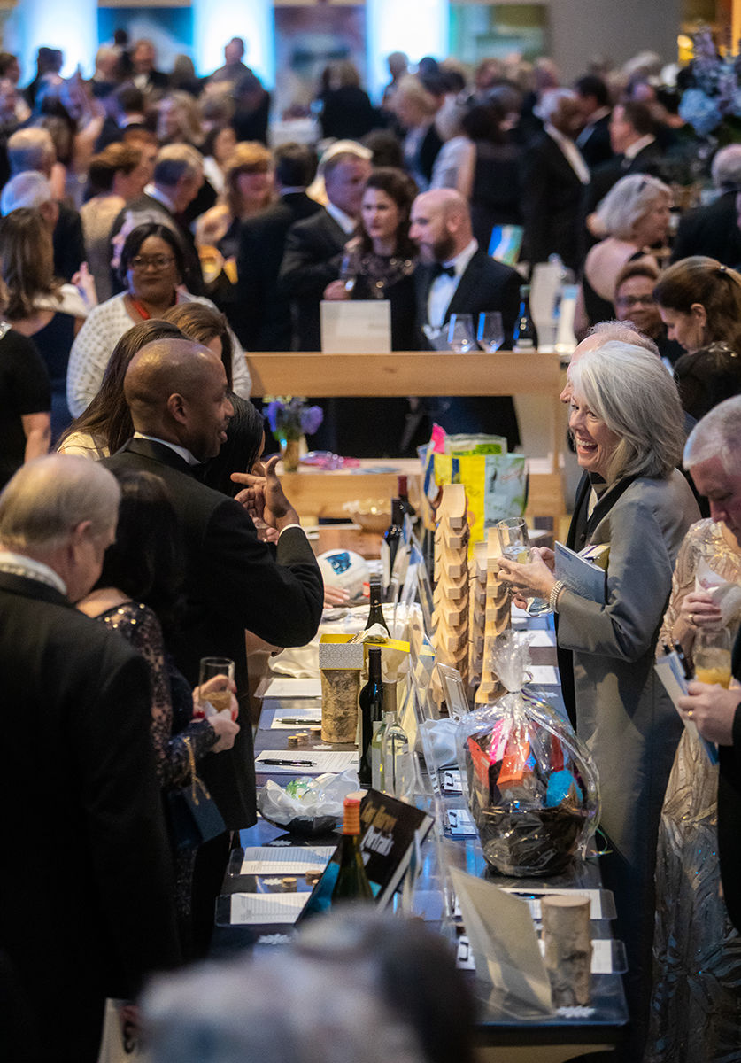 Guests bid on silent auction items in the College Center lobby.jpg
