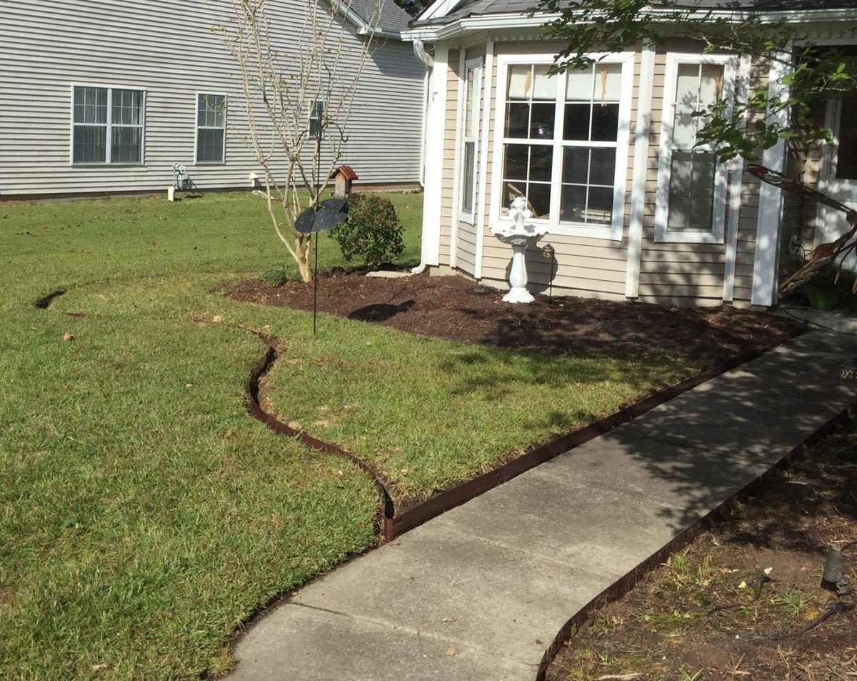 A Garden Hose Proves A Good Tool For Laying Out The Lines Of A