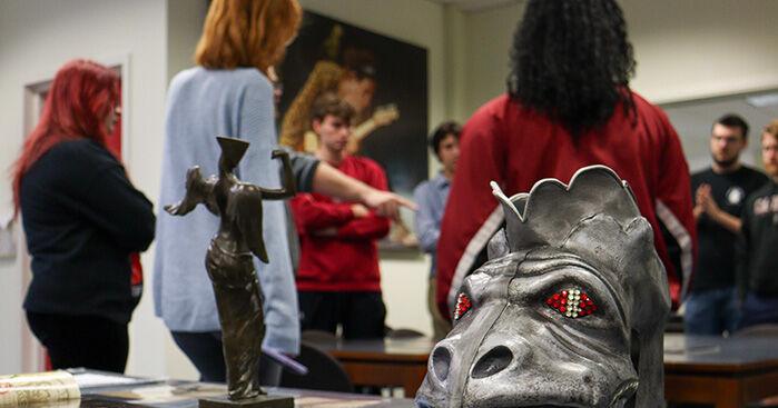 Gene Simmons’ battle-worn bass, signed records and original KISS setlists now on display at USC
