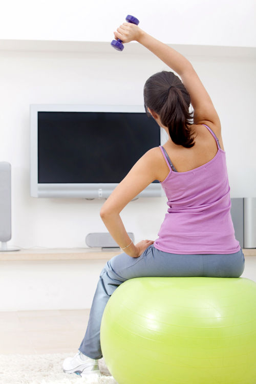 sitting on an exercise ball while watching tv