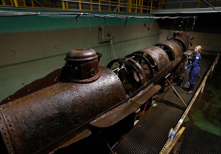 Scientists find human tooth inside H.L. Hunley submarine during cleanup