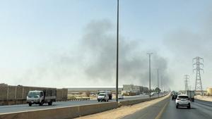 Smoke rises from a fire at the Aramco refinery south of Riyadh