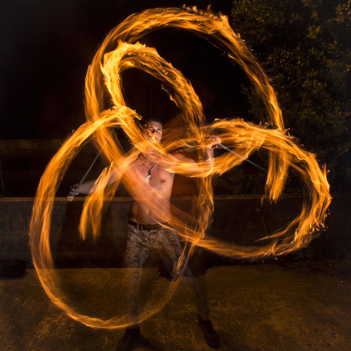 Fire spinners and flow artists in Charleston catching the heatwave