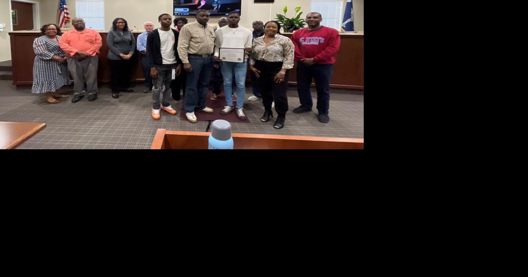 Two scholars honored at April School Board Meeting