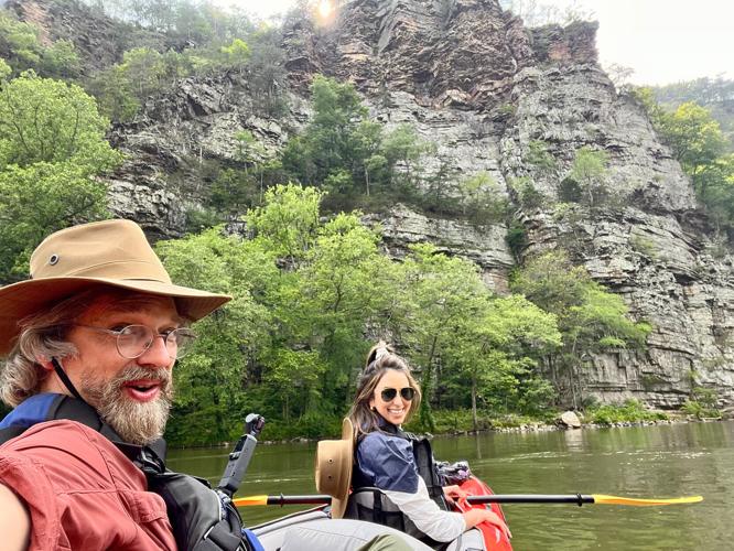 Doc Varn and Sophia Michelen stop for a selfie while kayaking on the French Broad River in North Carolina_.jpg