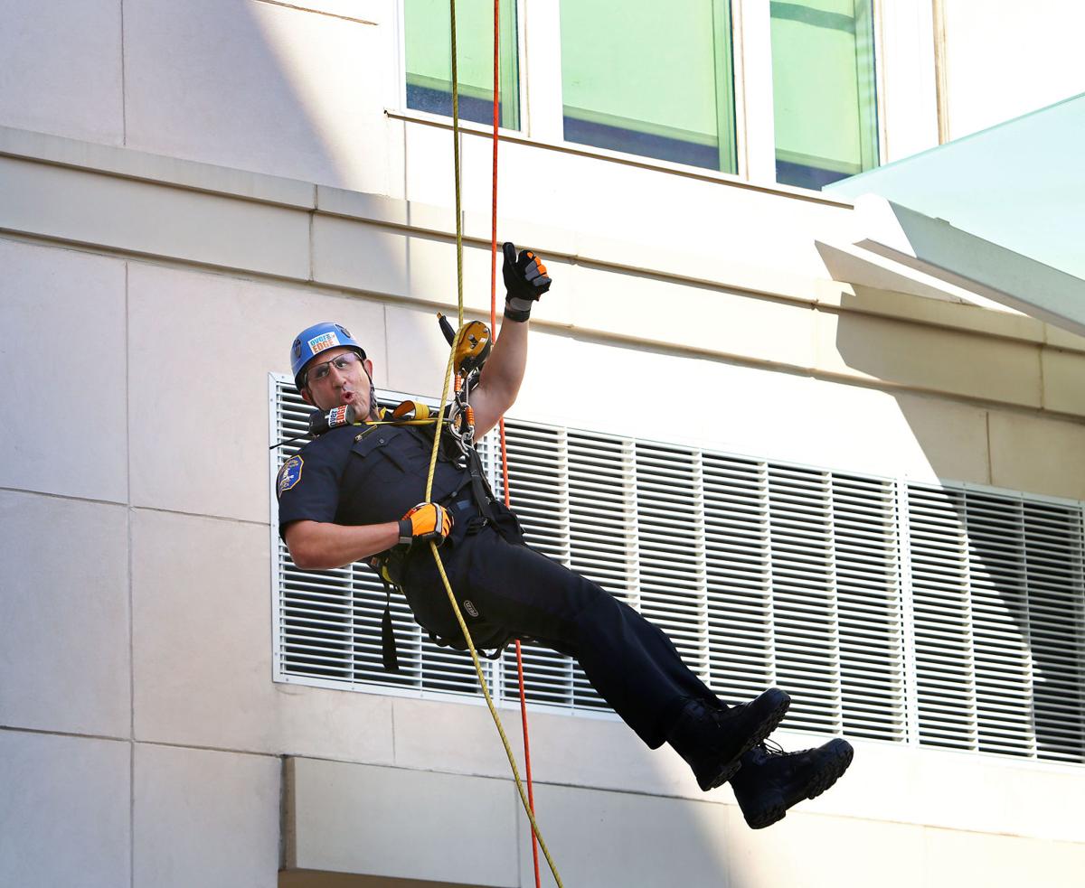 chief reynolds thumbsup rappelling united way.jpg