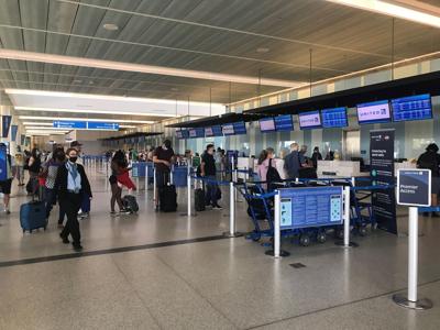 Charleston airport passengers in line at check-in