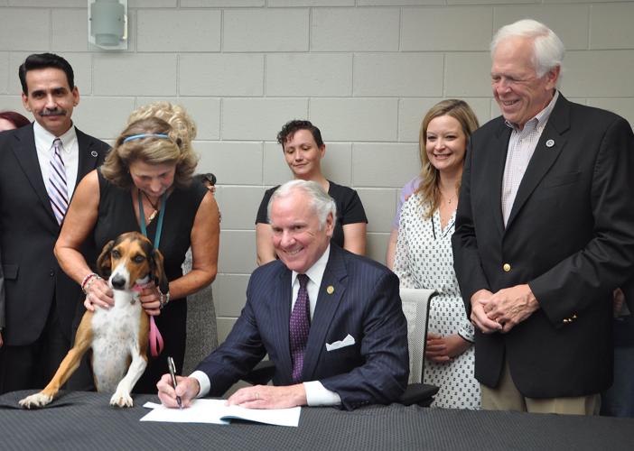 McMaster visits Albrecht Center for ceremonial signing of animal