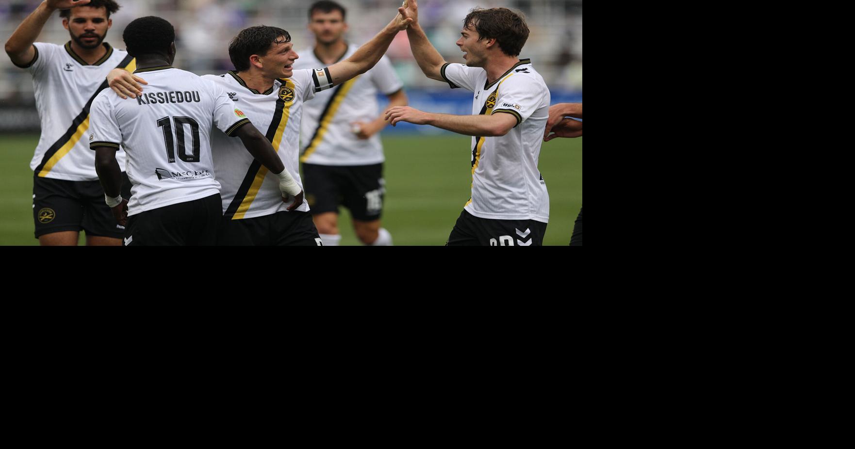 Battery race past league-leading Louisville for rain-soaked road victory