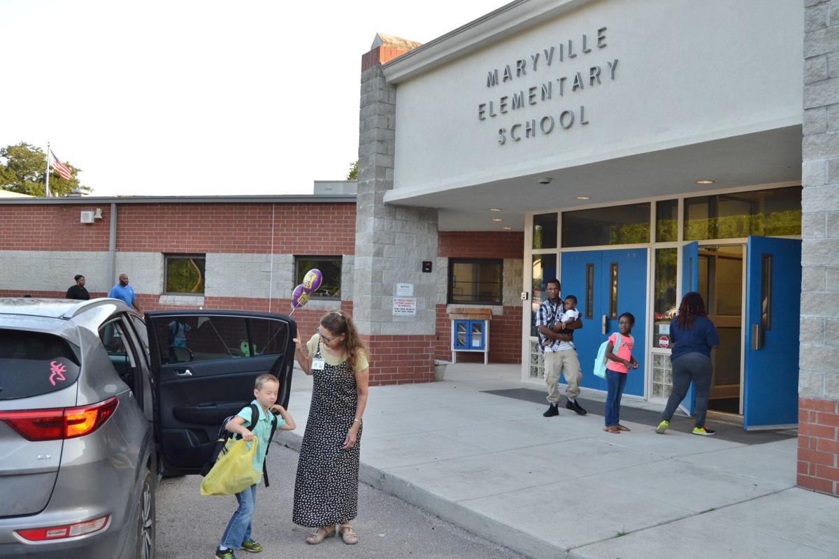 Hit the books County students return to school News