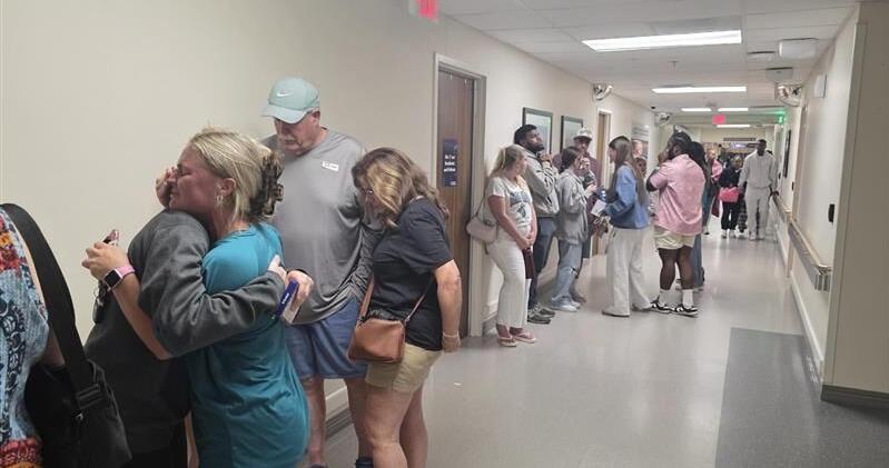 An agonizing honor walk pays tribute to Coastal Carolina student following hit-and-run crash