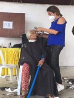 Saipan beautician provides free haircuts, food to over 700 people in the Philippines