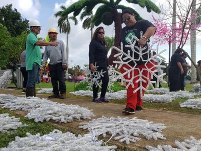GovGuam workers help set up Christmas display GovGuam workers help set up Christmas display